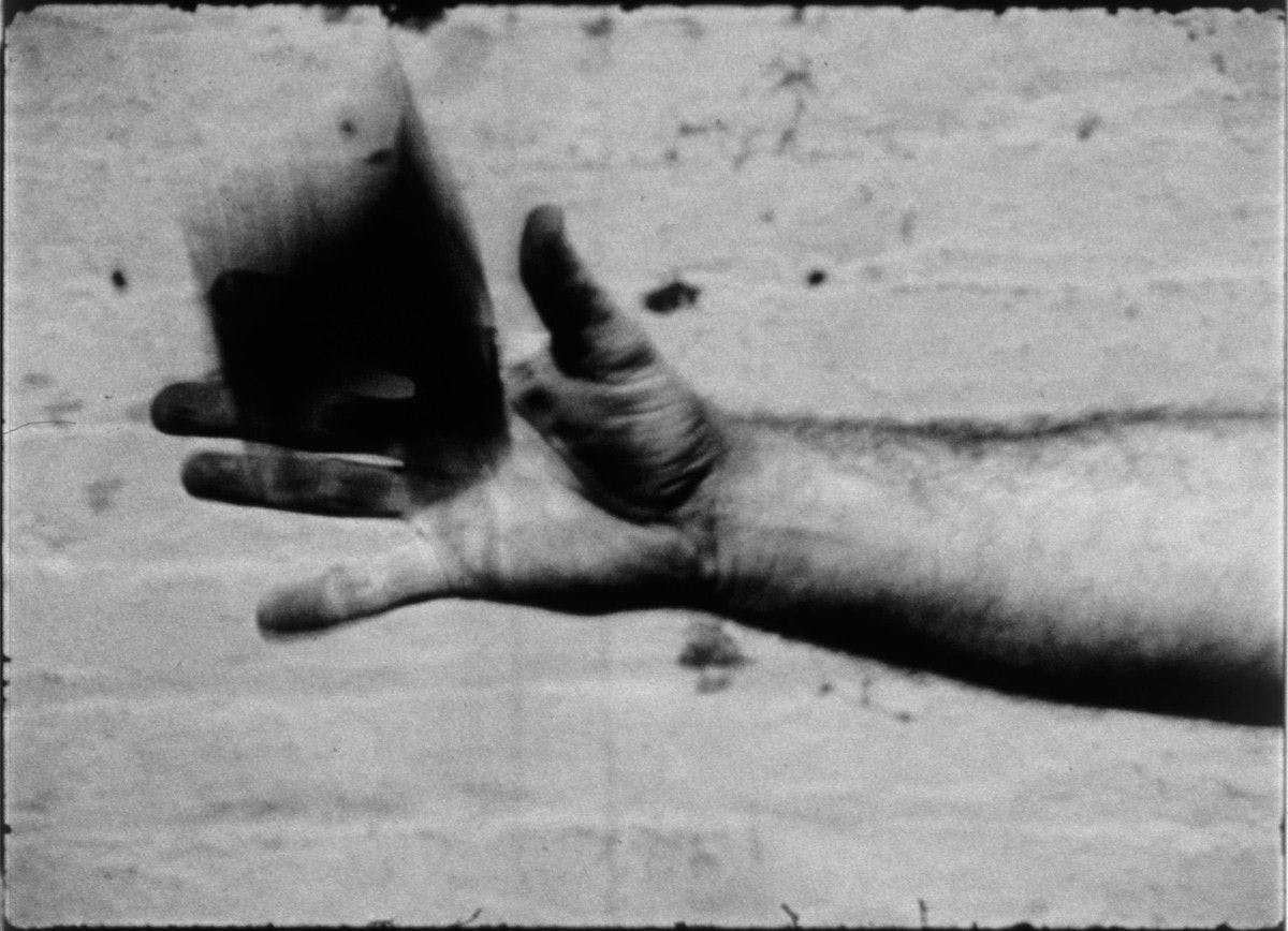 A still from Richard Serra, titled Hand Catching Lead, dated 1968, Collection of Museum of Modern Art, New York